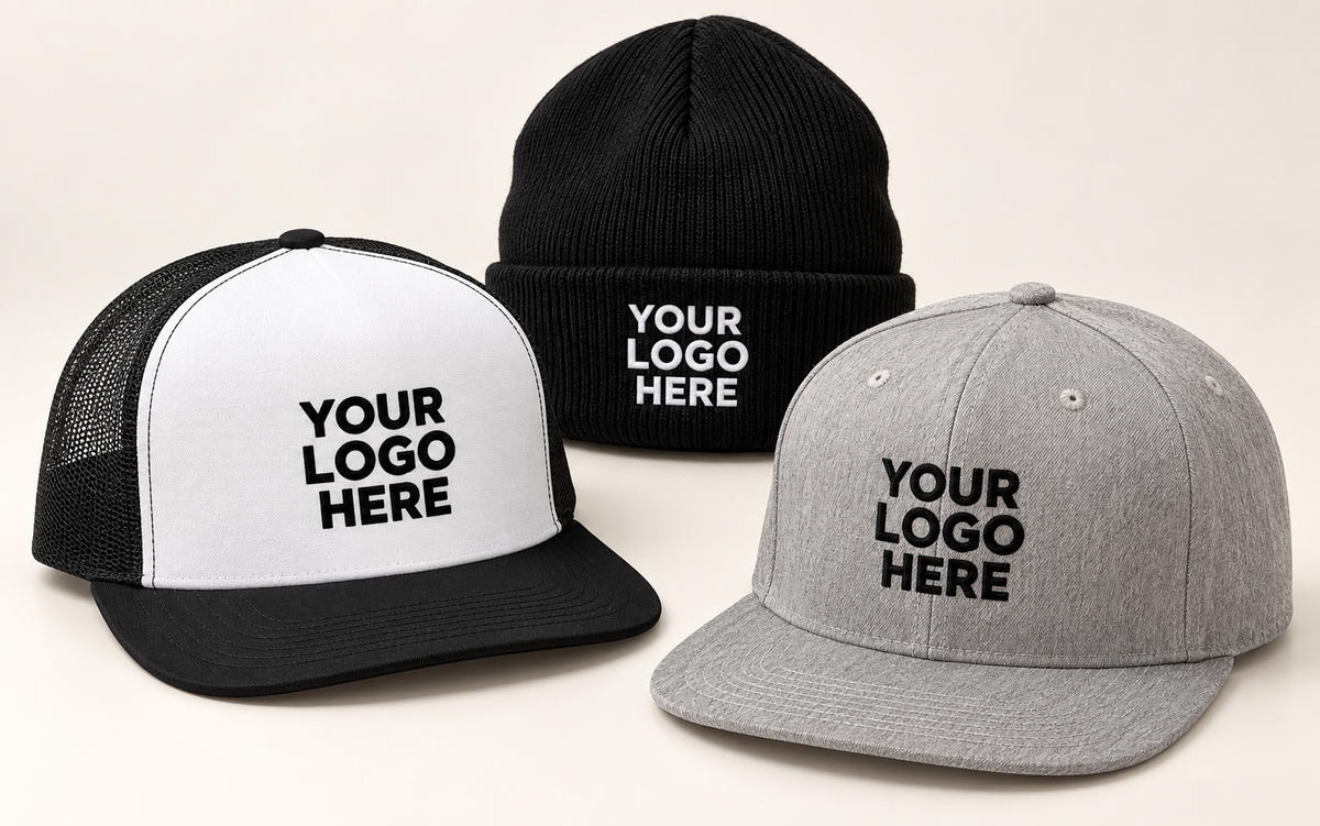 Grey snapback, white-front black-mesh trucker and black cuffed beanie with contrasting YOUR LOGO HERE lettering.
