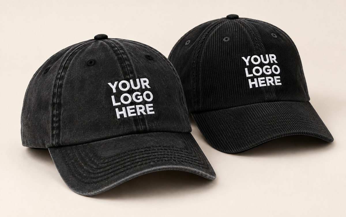 Black washed-cotton and corduroy caps with curved brims and white YOUR LOGO HERE embroidery.