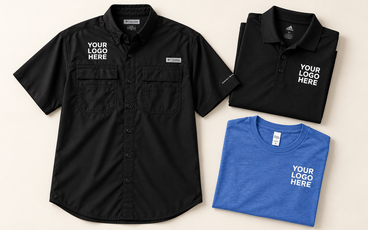 Black short-sleeve button-down, black polo and blue tee with white YOUR LOGO HERE, clear of pockets and plackets.