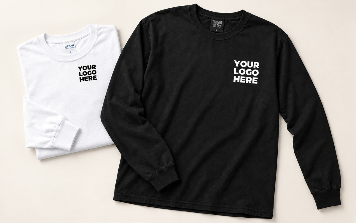 Black long-sleeve T-shirt and folded white long-sleeve T-shirt with contrasting YOUR LOGO HERE left-chest print.