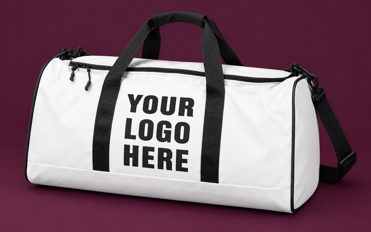 White duffle bag with black YOUR LOGO HERE print between black webbing straps on a mulberry background.