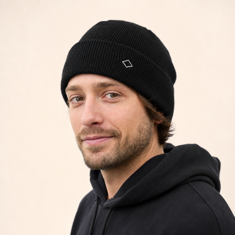 Person wearing a custom cuffed knit beanie, showing the fit