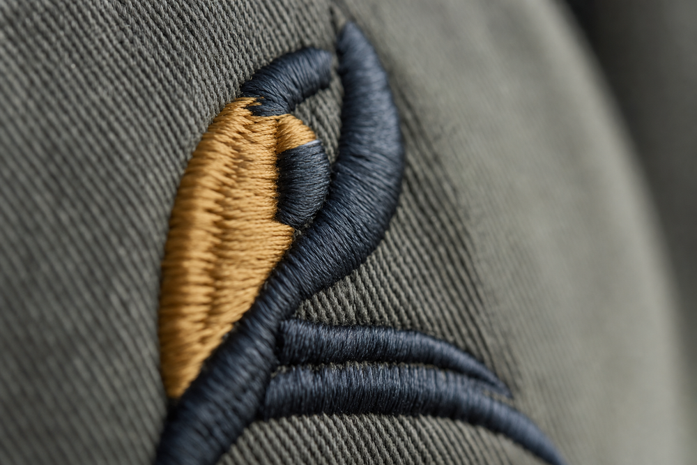 Close-up of custom hat embroidery showing raised stitch detail