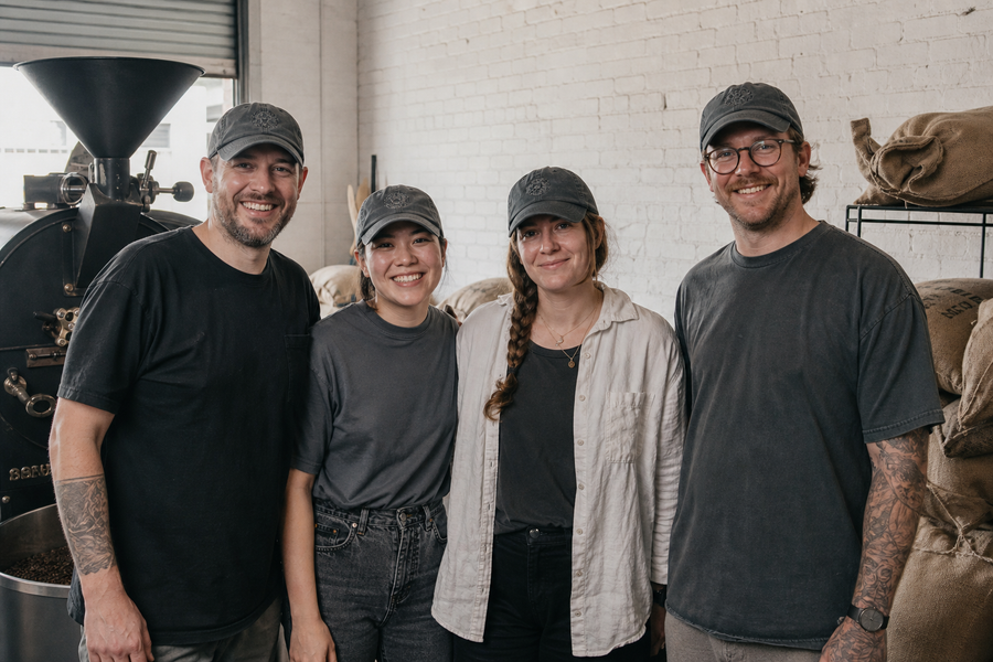 A taproom team in matching custom embroidered caps