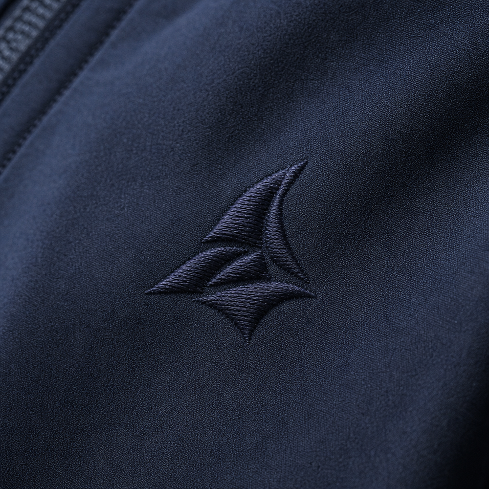 Close-up of an embroidered logo on a jacket