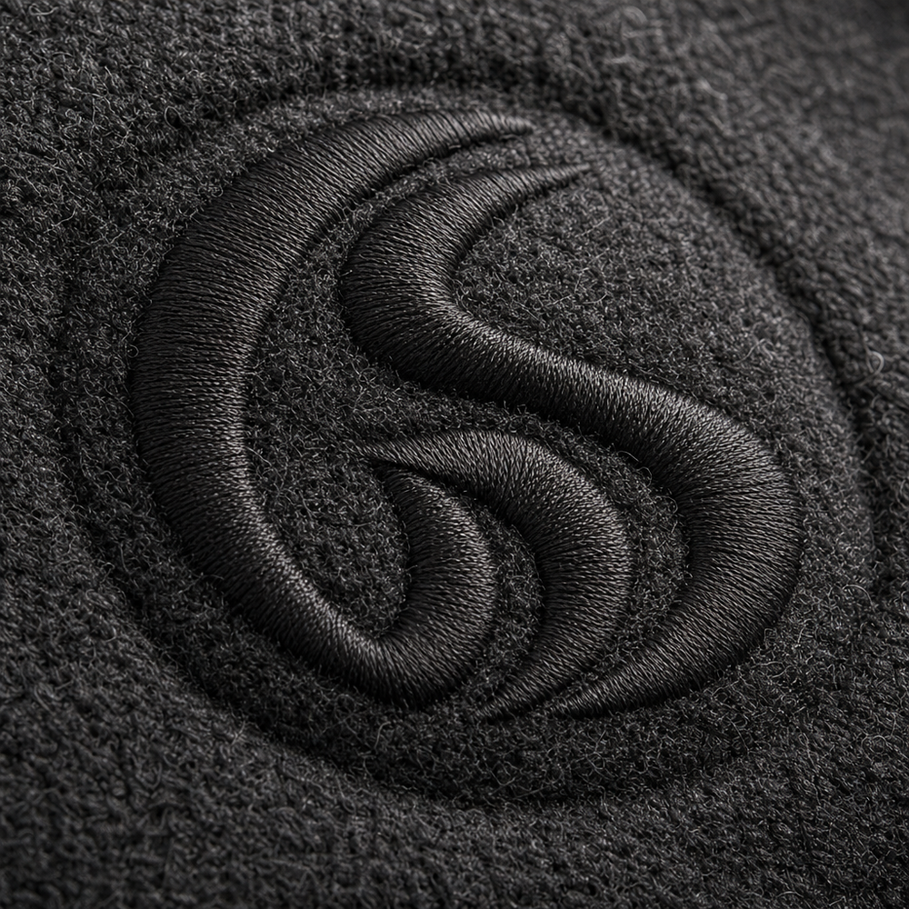 Close-up of an embroidered logo stitched into a custom sweatshirt
