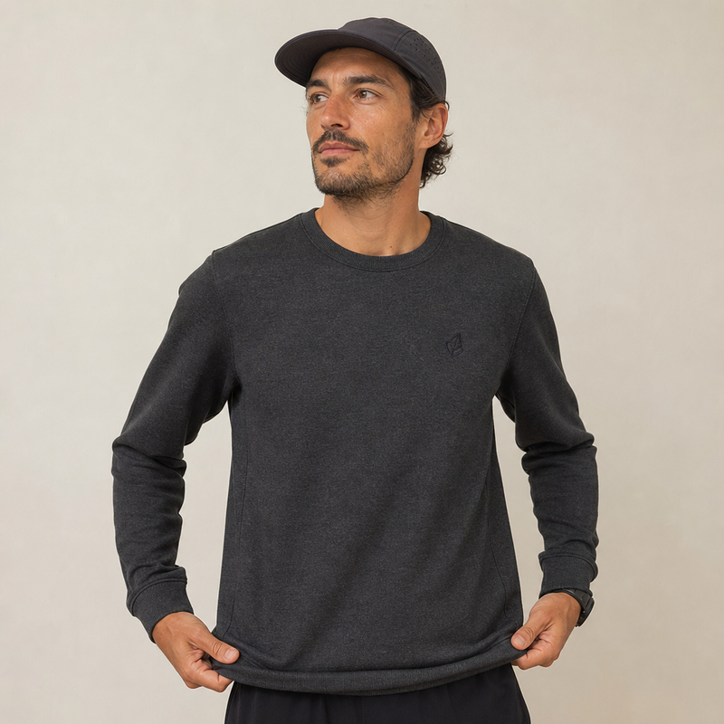 A man wearing a custom crewneck sweatshirt showing the fit