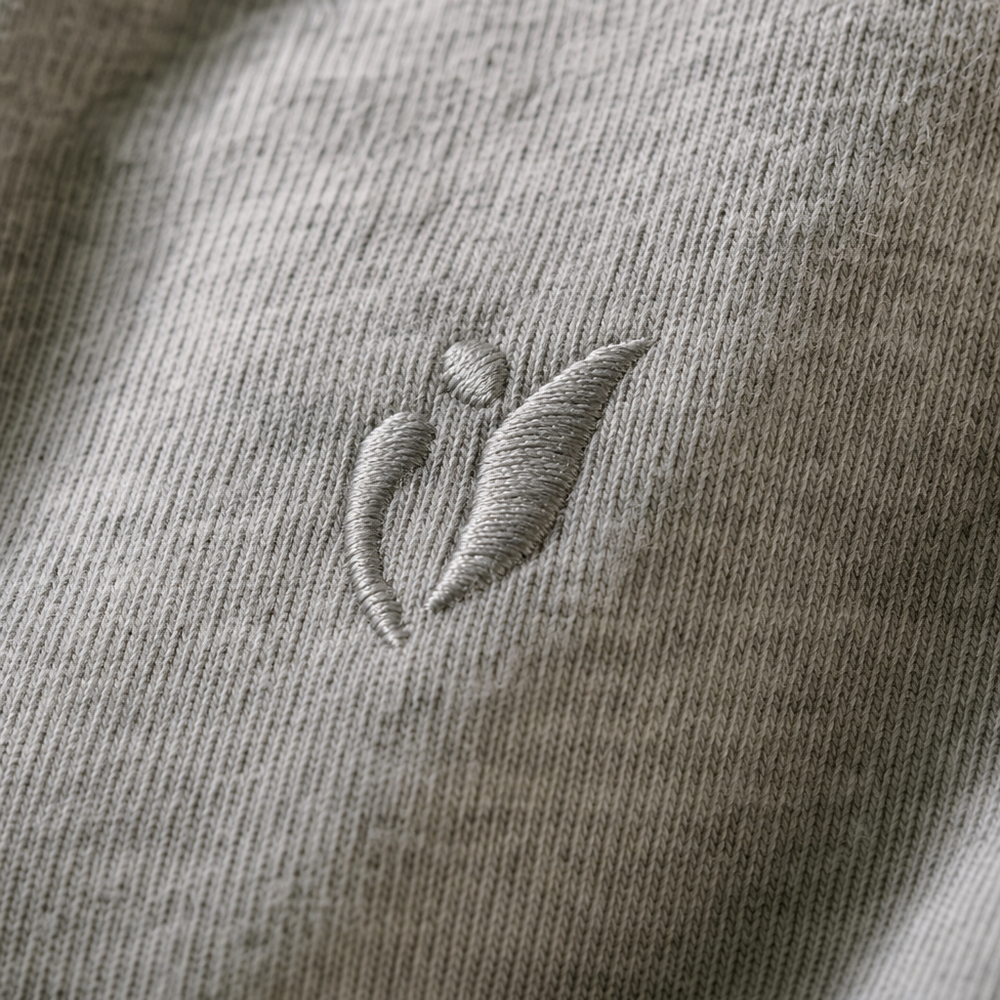 Close-up of an embroidered logo on a t-shirt